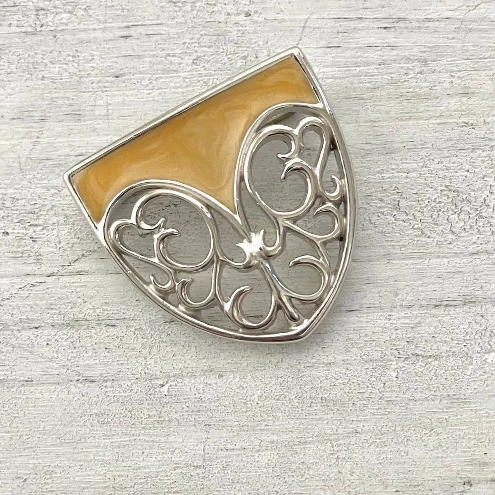 Monet silver tone and cream enamel shield brooch